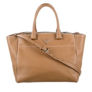 Prada tan leather tote bag with shoulder strap.